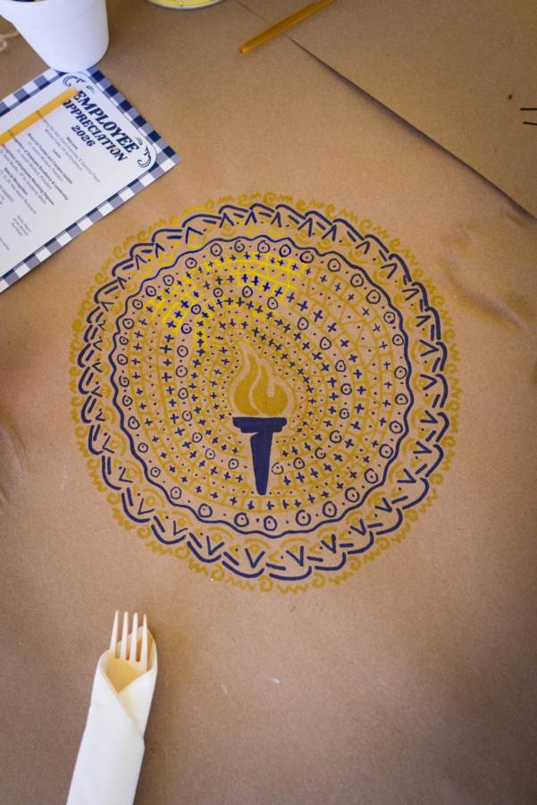 Employee Recognition_2026 Decorative Bushnell University torch-themed table art displayed during employee appreciation event