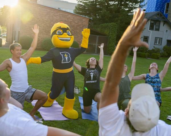 Group of people posing outside for photo Group of people posing outside for photo