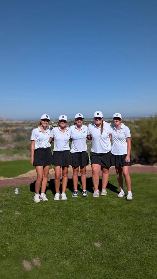 Person standing outside on grass Group of pe