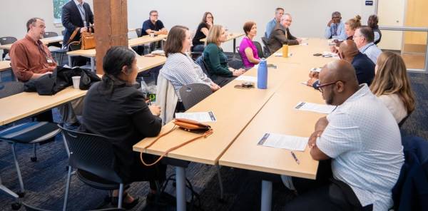 Group of people posing outside for photo Group of people posing outside for photo