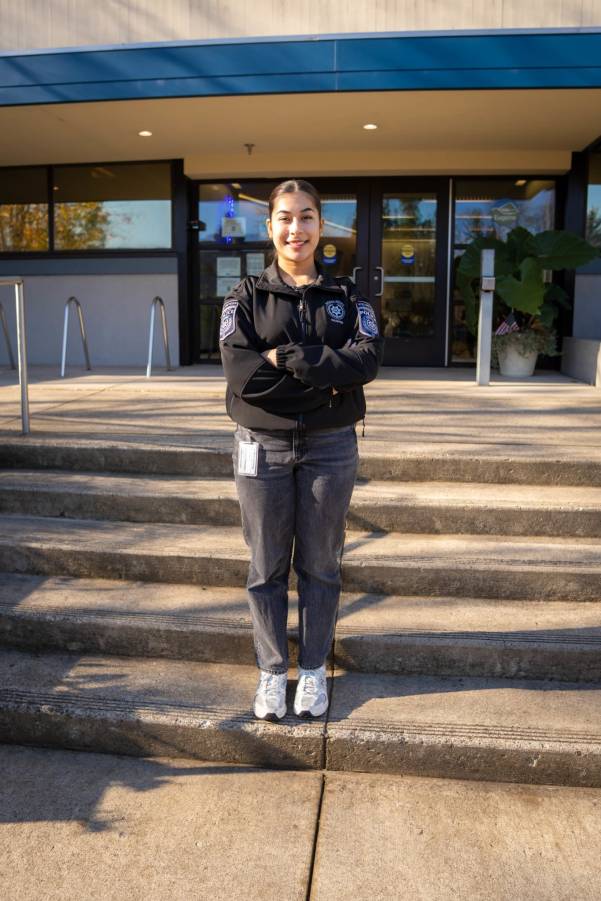 Man speaking into mic at podium Man speaking into mic at podium