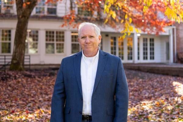 Two men walking on a road Two men walking on a road