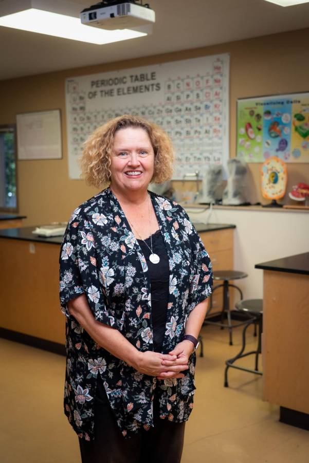 Person in lab in front of equipment Person in lab in front of equipment