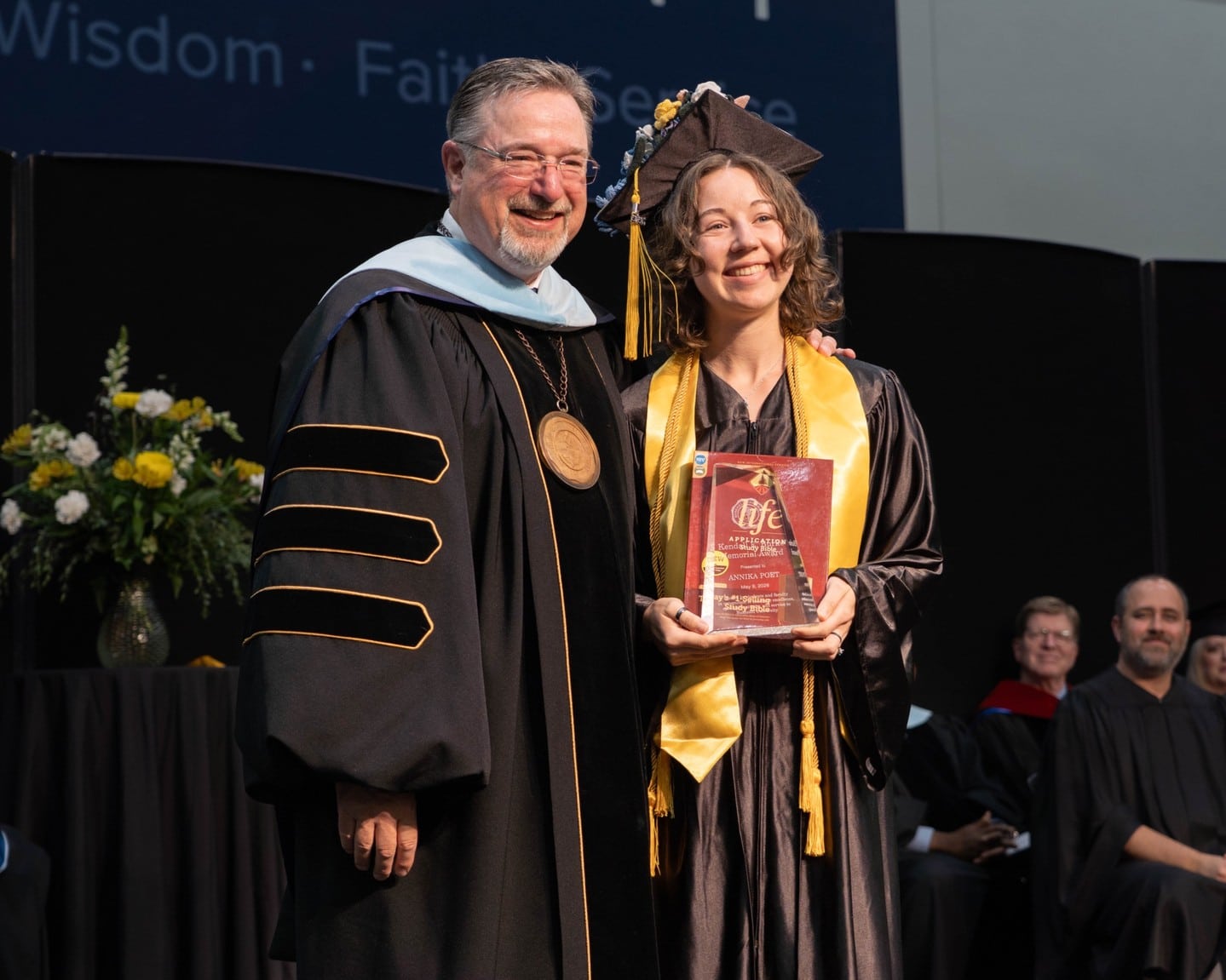 Congratulations to Annika Poet for receiving the Kendall E. Burke Award, one of Bushnell University's highest honors! 🏆

Annika was presented the award during Spring Commencement, where she graduated summa cum laude with a Bachelor of Science in Biology and received a medallion as a Song Nai Rhee Honors Scholar.

The recipient of the Dr. Kendall E. Burke Award, determined through a vote by the student body and faculty of Bushnell University, is presented with a distinctive Bible during the Spring Commencement service. This award is bestowed upon individuals who have demonstrated exceptional academic achievement, served as a source of inspiration to both students and faculty, embodied high ideals of Christian character, and made significant contributions to the University’s mission. This distinguished honor was named in tribute to the late Dr. Kendall E. Burke’s wholehearted Christian service to the University.

Great work, Annika!