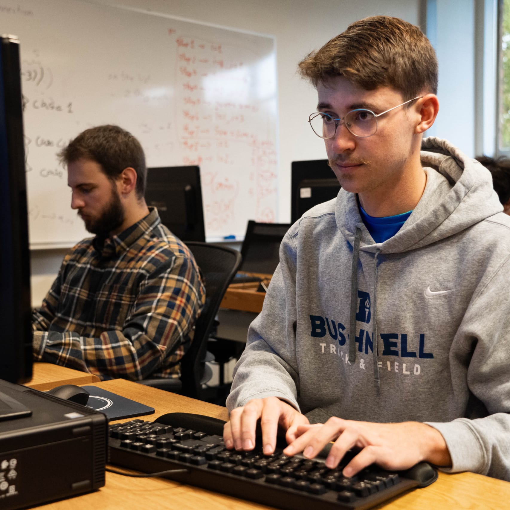 Male students on computers