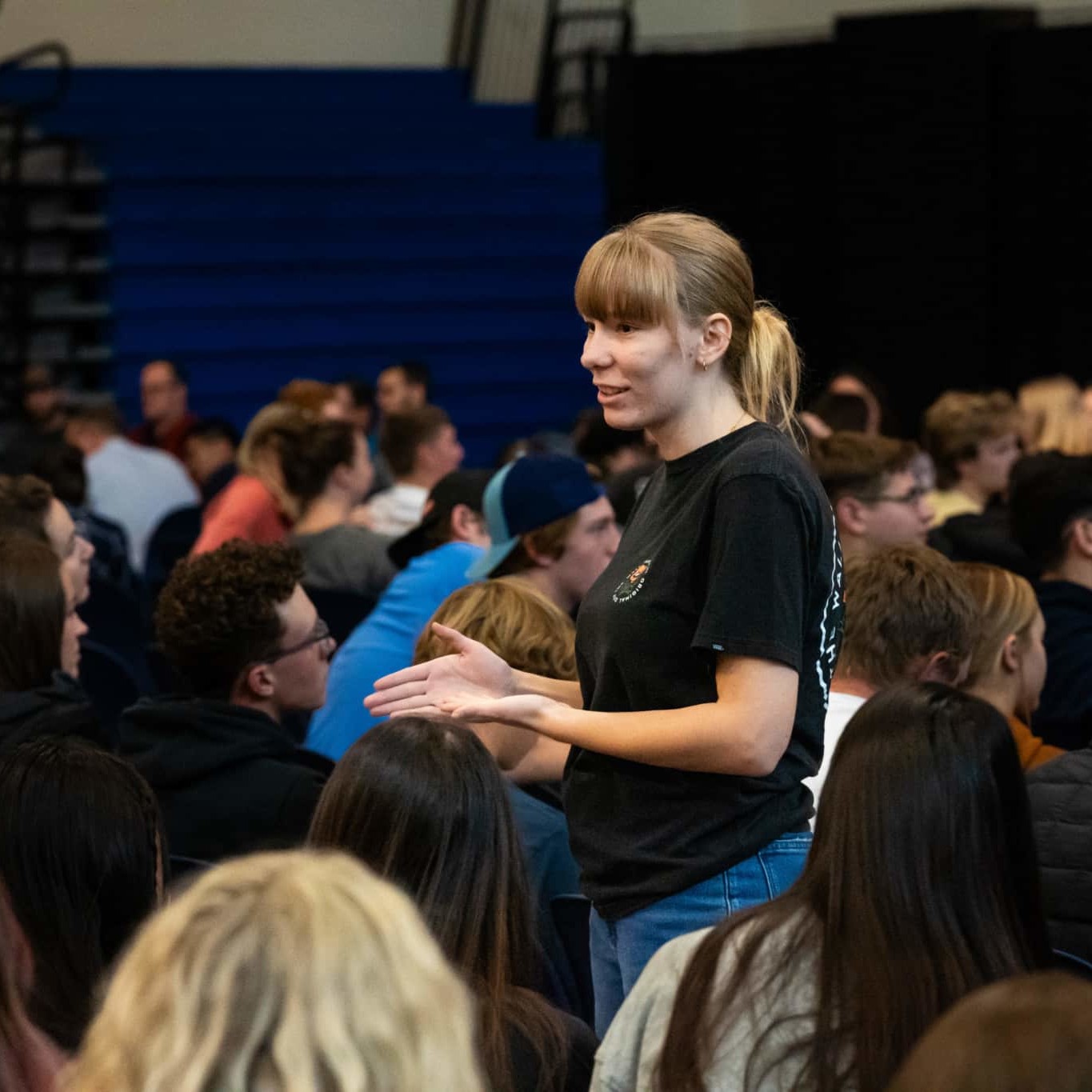 person talking to a group of people