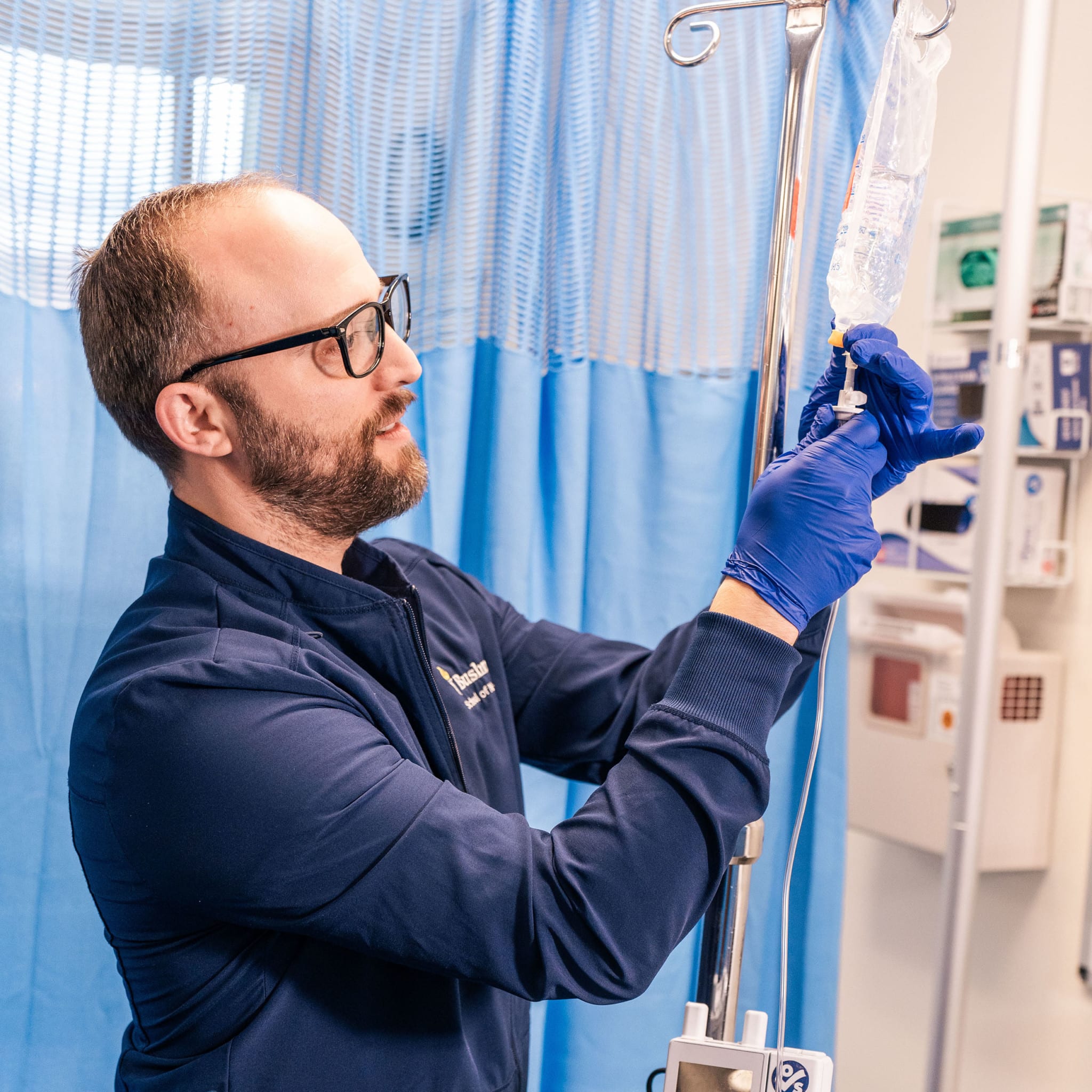 Nursing student prepares an IV bag