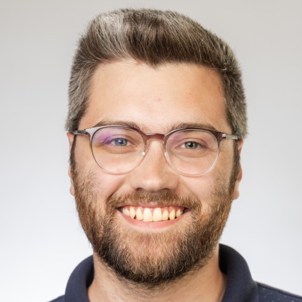 person speaking in front of podium