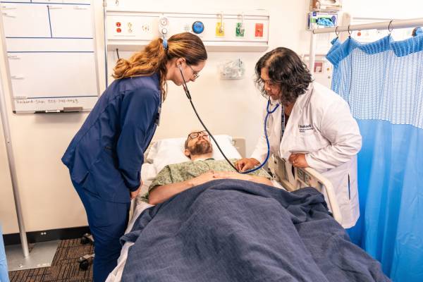 A group of people in a hospital room