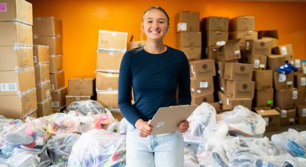 A group of basketball players and fans celebrating