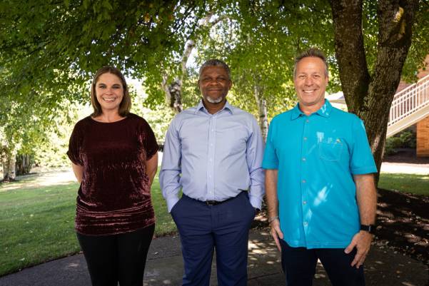 Group of people posing outside for photo