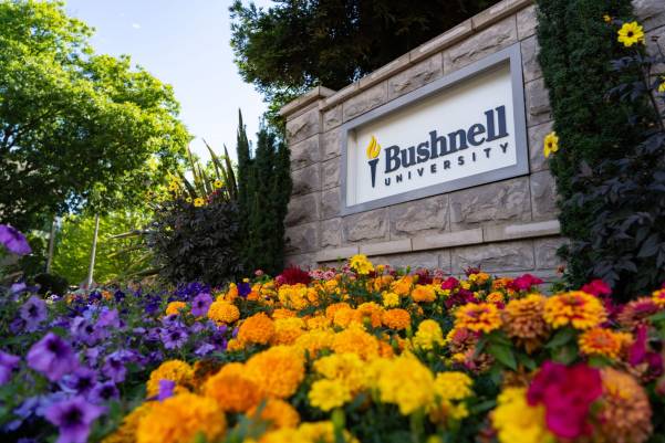 Campus sign with flowers