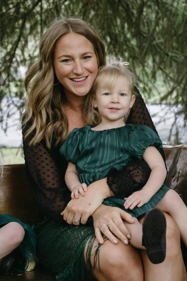 female holding a small child on lap