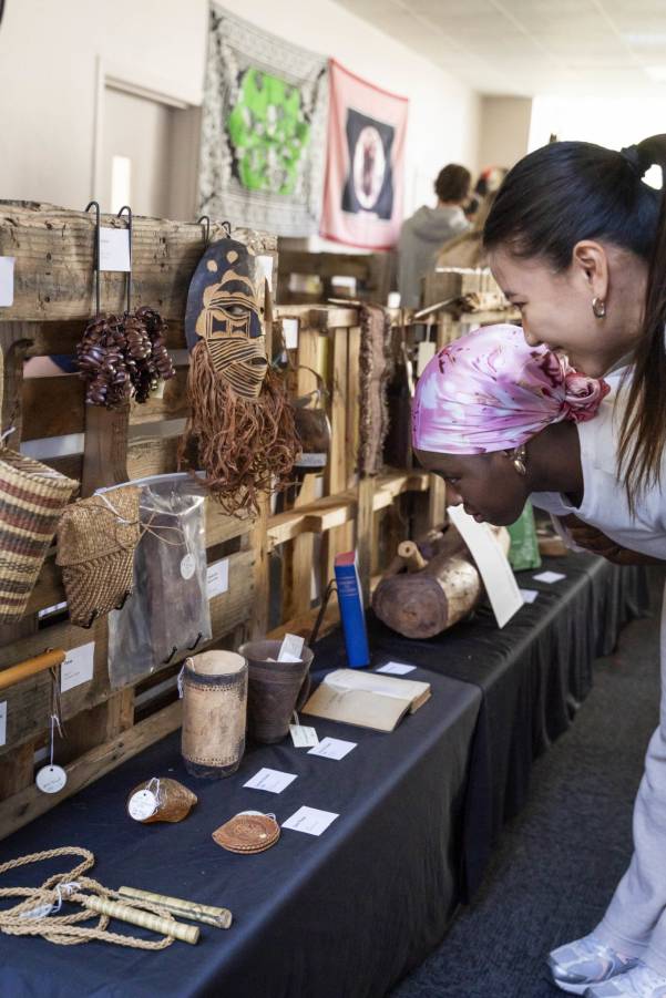 People looking at artifacts in a pop up museum