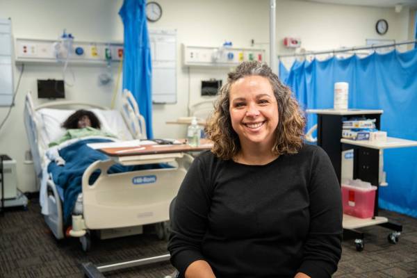 Person sitting in nursing sim lab