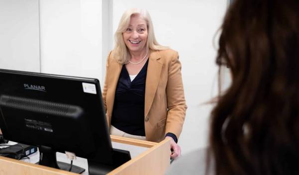 Person at computer talking to someone